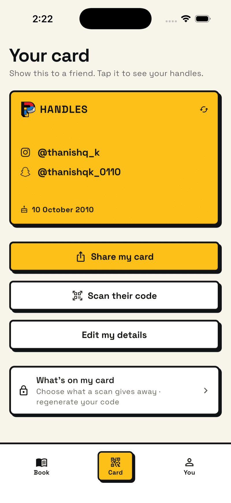 The Card screen: your QR code with the handles it shares, and a button to scan someone else's